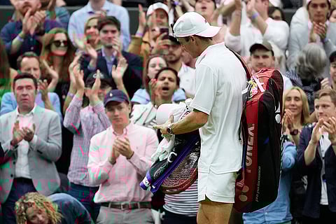 Tommy Paul walks from the court after his loss to Carlos Alcaraz